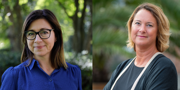 Två personer med grönska i bakgrunden.